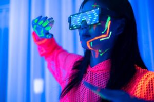 Active teen girl playing game in vr headset, having fun in virtual reality world